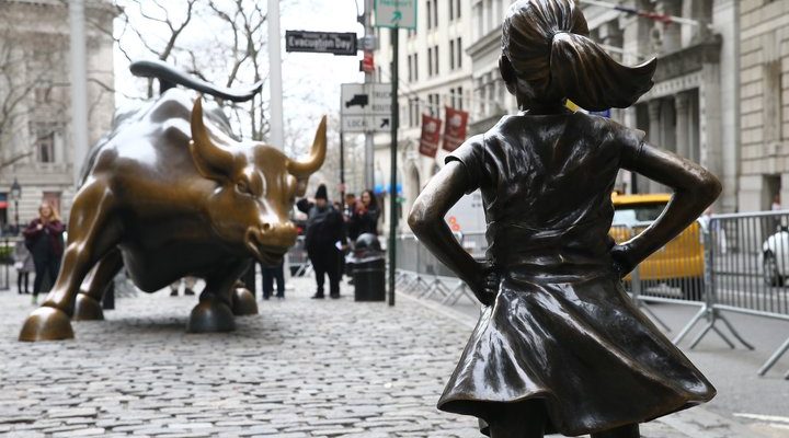 NEW YORK, USA - MARCH 29: The "Fearless Girl" statue, a four-foot statue of a young girl, defiantly looks up the iconic Wall Street "Charging Bull" sculpture in New York City, United States on March 29, 2017.  "Fearless Girl" statue was installed in front of the bronze "Charging Bull" for International Women's Day earlier this month to draw attention to the gender pay gap and lack of gender diversity on corporate boards in the financial sector. The statue will remain at her post until February 2018.






 (Photo by Volkan Furuncu/Anadolu Agency/Getty Images)