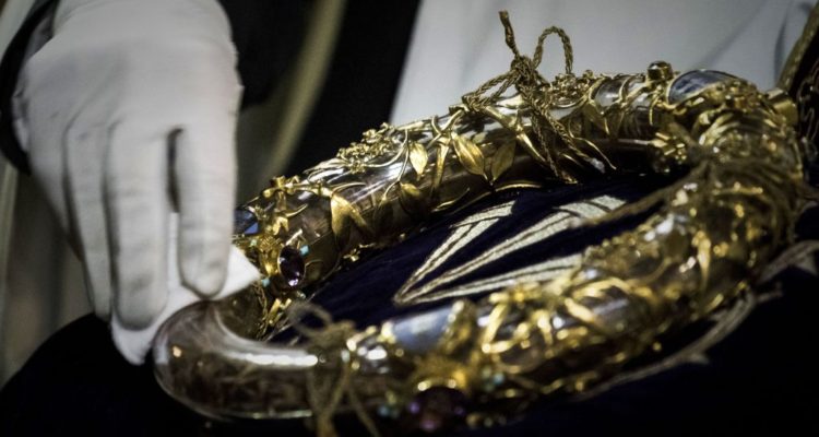 A priest wipes the Crown of Thorns, a relic of the passion of Christ- at the Notre-Dame Cathedral in Paris on April 14, 2017.
/ AFP PHOTO / Philippe Lopez (Photo credit should read PHILIPPE LOPEZ/AFP/Getty Images)
