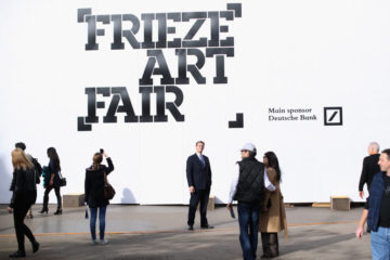 LONDON, ENGLAND - OCTOBER 18:  Art enthusiasts prepare to enter the Frieze London Art Fair on October 18, 2013 in London, England. The annual Frieze Art Fair takes place in London's Regent's Park and runs from October 17 to 20. The exhibition comprises of the Frieze Masters exhibition and Frieze London which aim to showcase historic and established art as well as contemporary works.  (Photo by Oli Scarff/Getty Images)