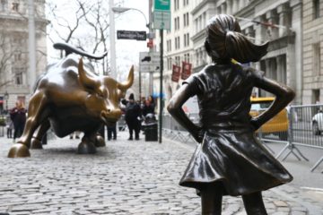 NEW YORK, USA - MARCH 29: The "Fearless Girl" statue, a four-foot statue of a young girl, defiantly looks up the iconic Wall Street "Charging Bull" sculpture in New York City, United States on March 29, 2017.  "Fearless Girl" statue was installed in front of the bronze "Charging Bull" for International Women's Day earlier this month to draw attention to the gender pay gap and lack of gender diversity on corporate boards in the financial sector. The statue will remain at her post until February 2018.






 (Photo by Volkan Furuncu/Anadolu Agency/Getty Images)