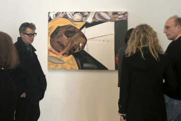 A group of museum-goers examine a painting entitled "Open Casket" by artist Dana Schutz at the Whitney Museum of American Art in New York, Thursday, March 23, 3017. The painting, made with the aid of historical photographs of Emmett Till as he lay in his casket, has left some gravely displeased and triggered outcry. Till was a 14-year-old black teenager when he was killed by white men in 1955 for allegedly whistling at a white woman. (AP Photo/Alina Heineke)